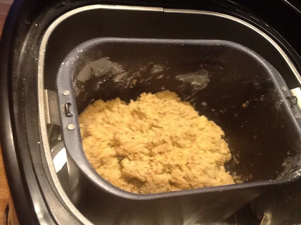 When the machine starts to mix, check to see that all the flour from corners and underneath are mixed in well. You may have to add a few drops water. Careful, not too much or you get hot dough.