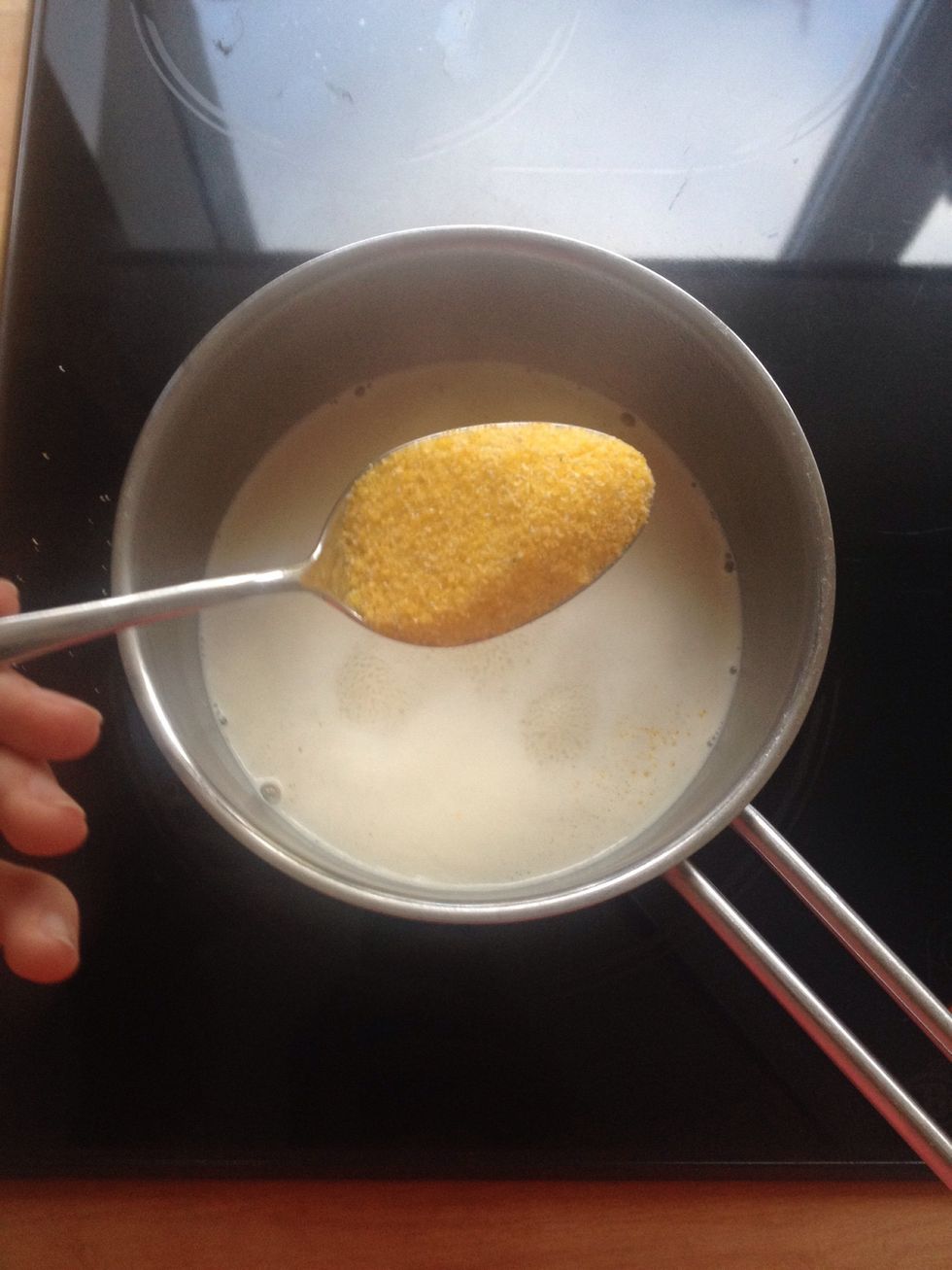 When the milk is warm you have to put 2 tsp. of semolina ( I used corn semolina ).