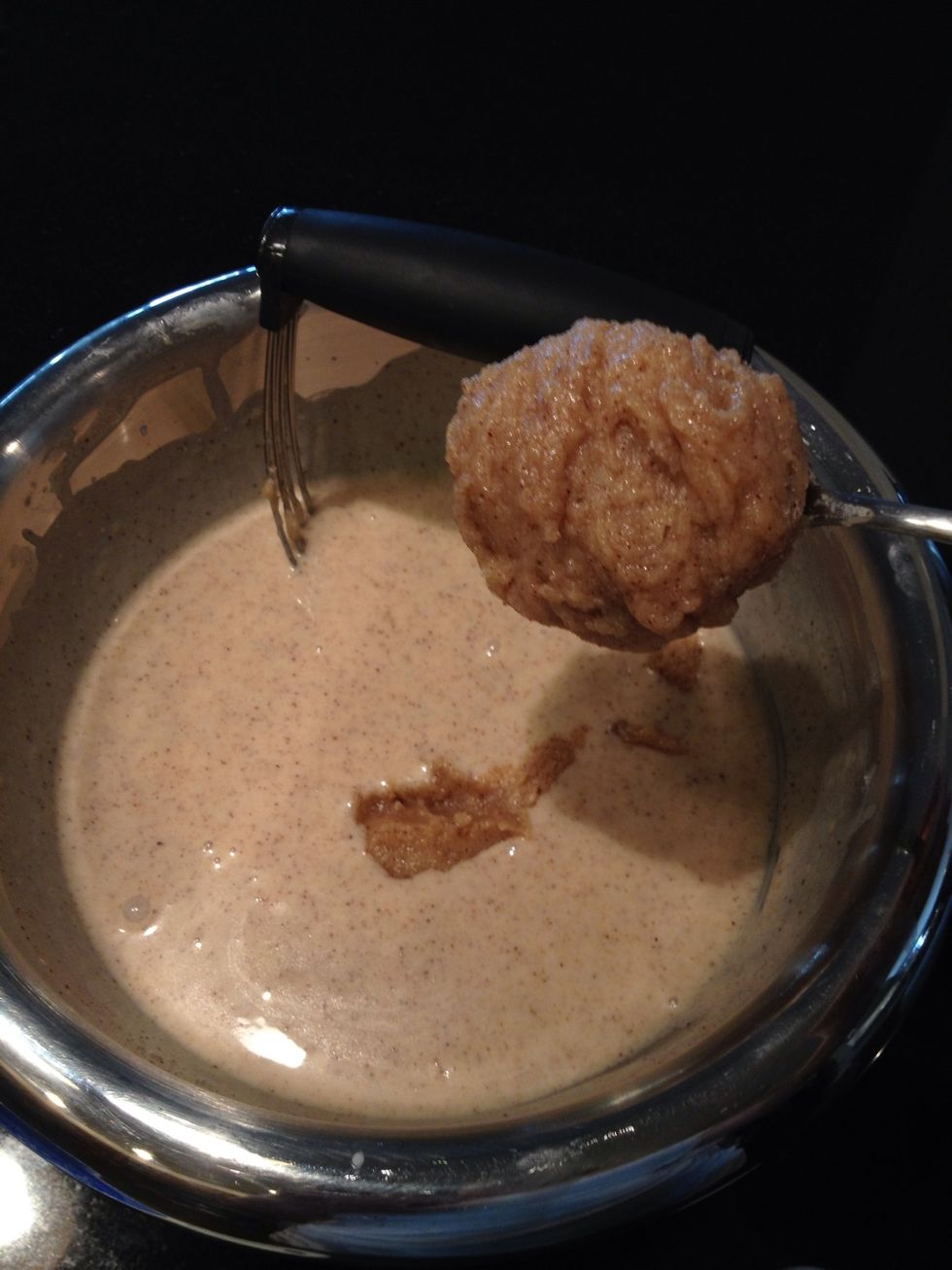 When the mix is even, add more batter a spoonful at a time and mix it in until you've used all the batter.