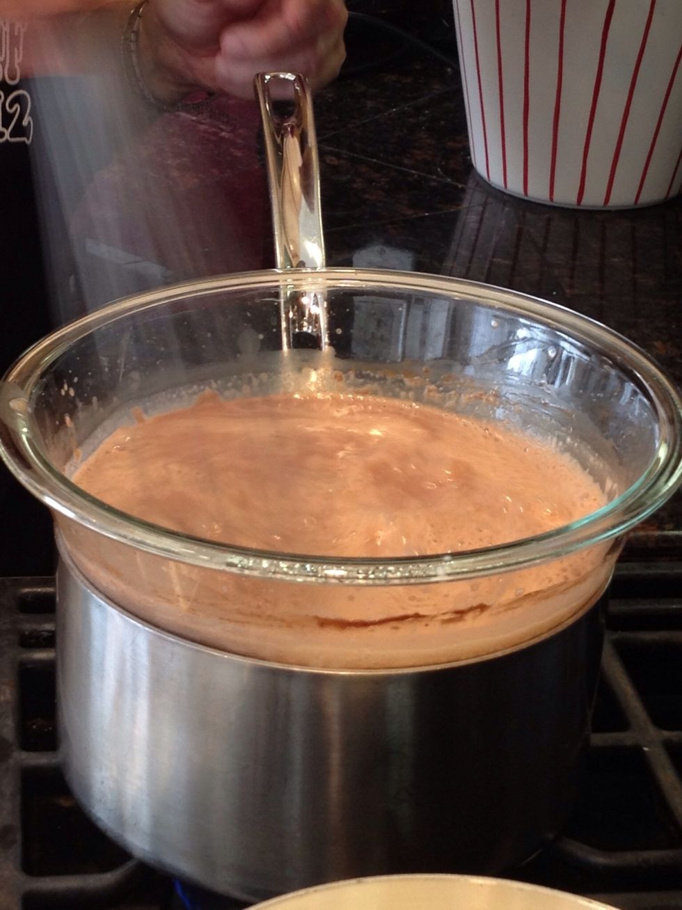 When the mix is right, to tour taste, leave the hot chocolate on the double boiler until it is heated through. Then whisk to a froth.