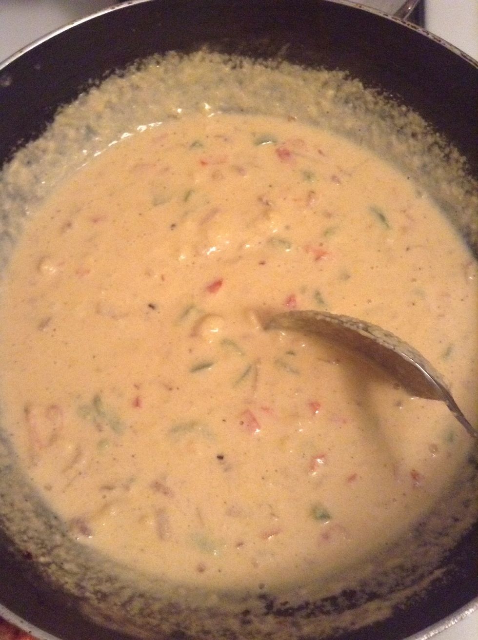When the mixture comes to a boil, immediately stir in the cornmeal and reduce the heat to low.