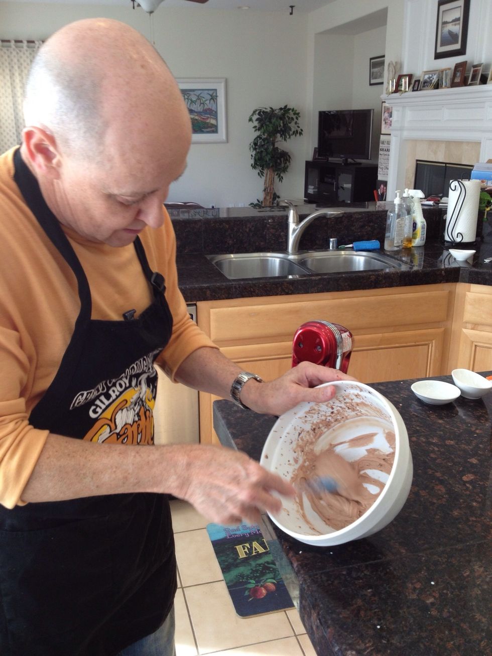 When the mixture has a whipped cream consistency, scrape it into another bowl.