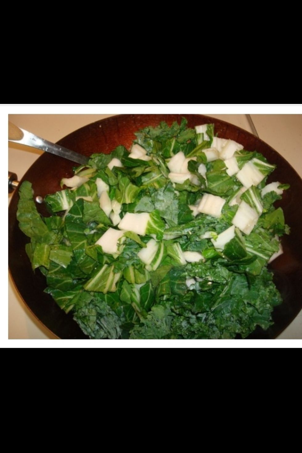 When the mushrooms have cooked, add your greens.  These will cook down substantially in a few minutes.