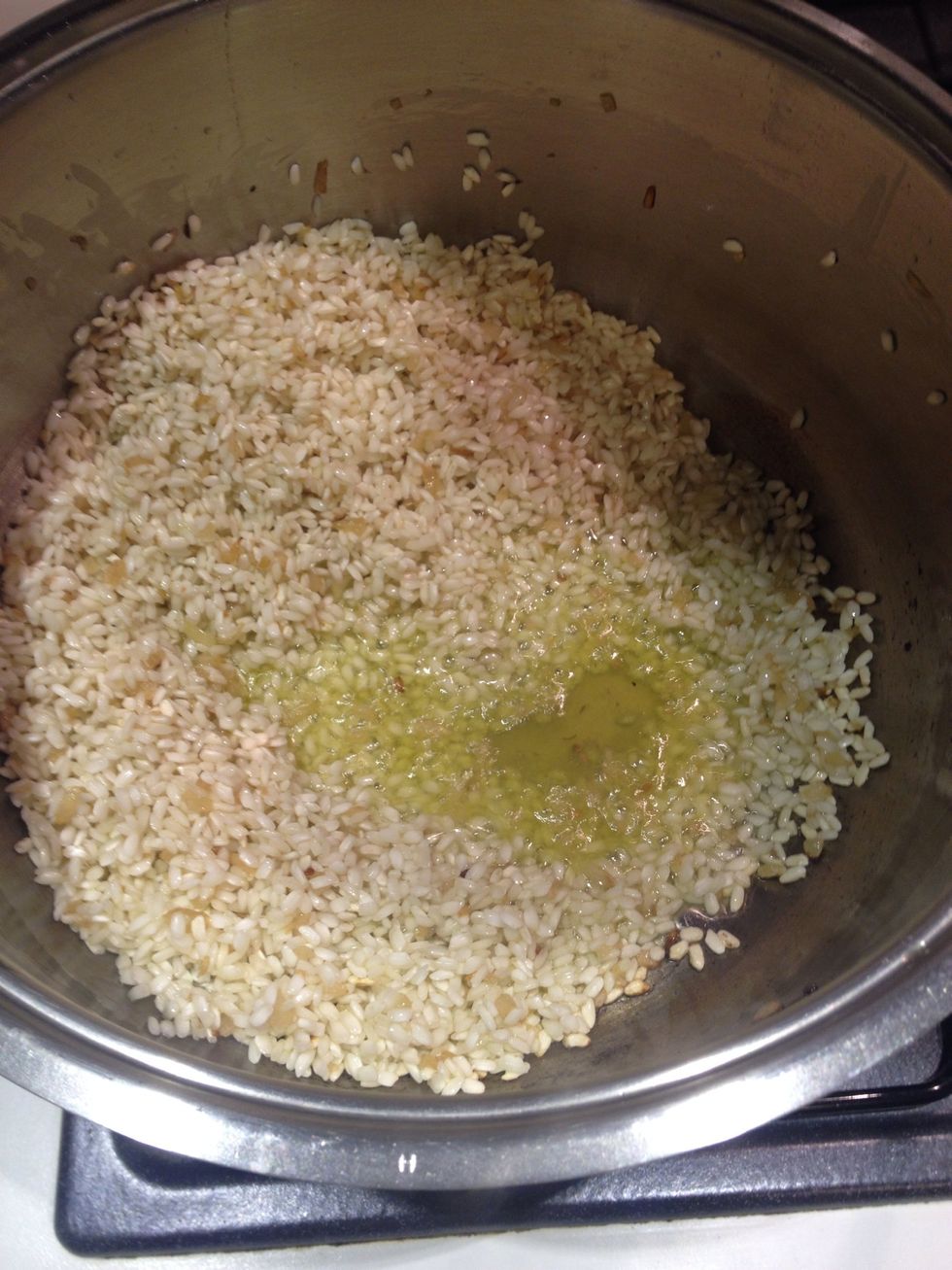 When the oil and onion are fried add the rice and toast it for two minutes twist with a long spoon frequently