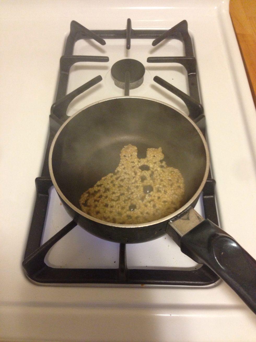 When the oil is hot, add 1 tbsp minced garlic.