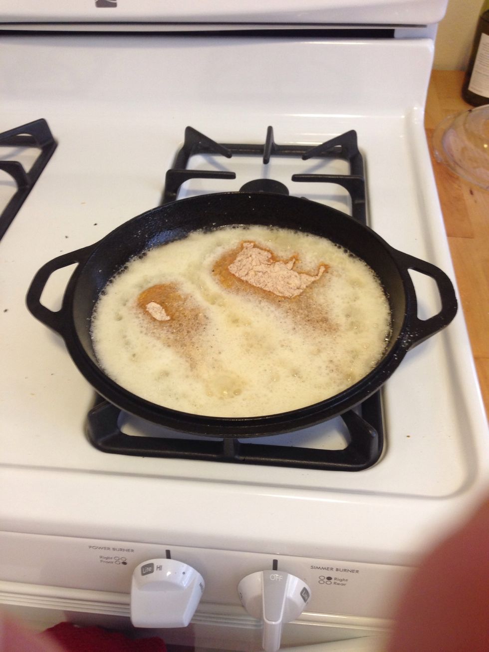 When the oil is hot, Add the chicken to the pan. Be careful not to burn yourself. Using thongs is helpful. If you aren't sure if the oil is hot, put a bit of flour in the pan. It starts cooking. ;)