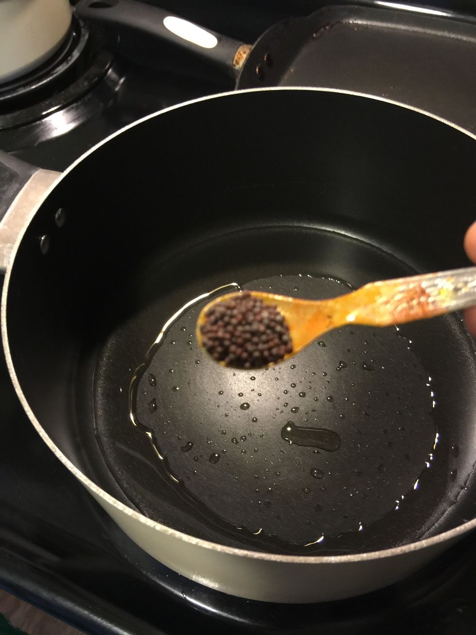 When the oil is hot, First add the mustard seeds, let them splutter.
