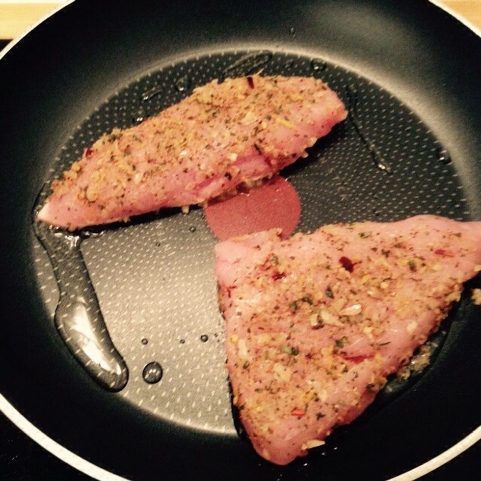 When the oil is hot place the two fillets