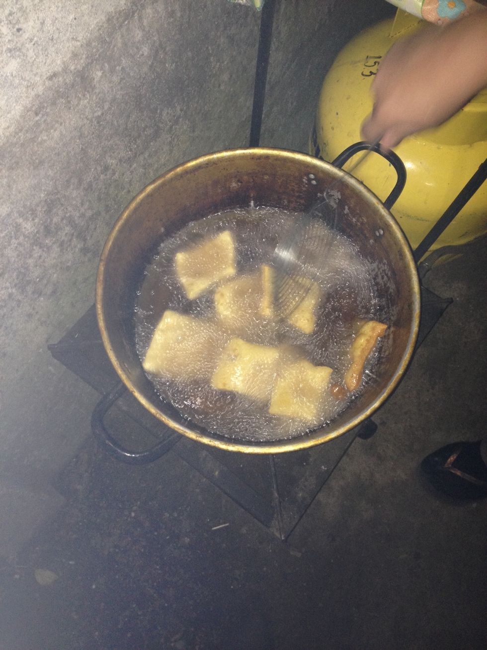 When the oil is ready (tip: drop a sopaipilla into the oil. If it rises to the top immediately, your oil is hot enough) add as many Sopaipillas as you can without overcrowding the pan.
