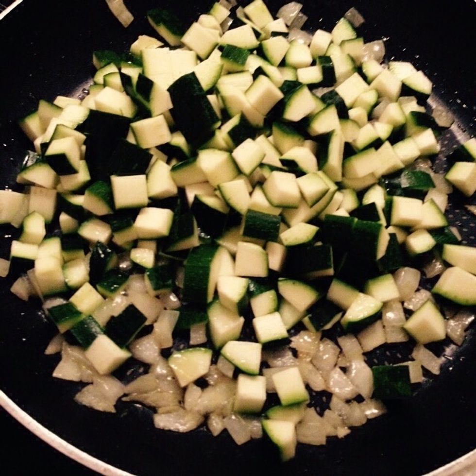 When the onion becomes translucent add the diced courgette in, lower the heat and roast evenly and gently, adding water if too dry but not too much to don't spoil then