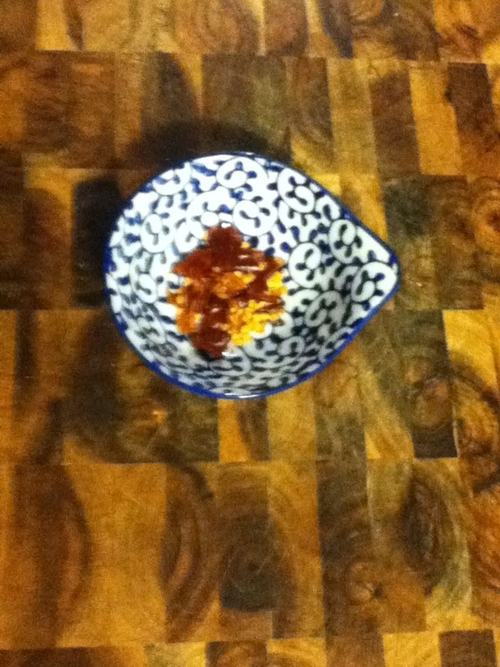 When the onions are almost done, rip up a few dried chiles...