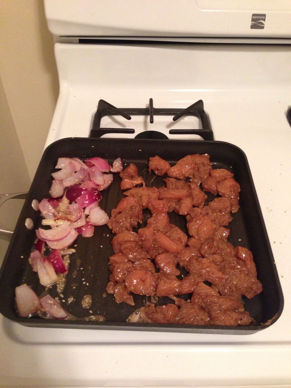 When the onions are almost finished cooking, add the chicken.