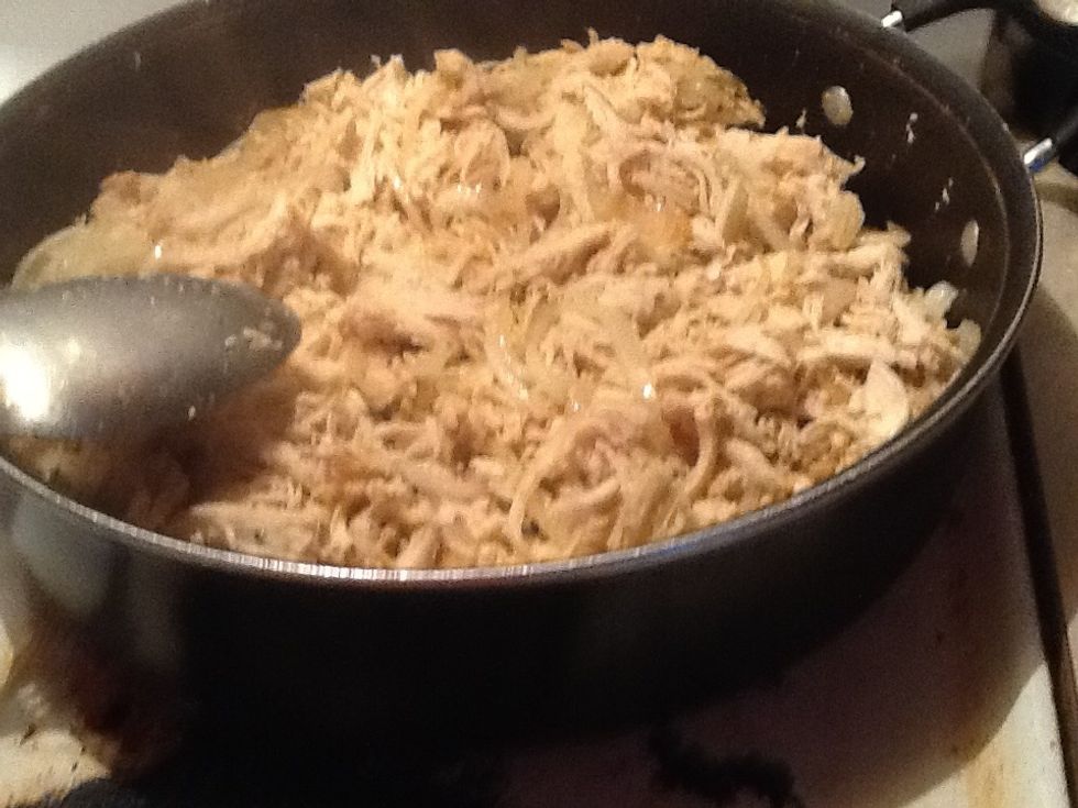 When the onions are grilled add your pulled apart chicken then