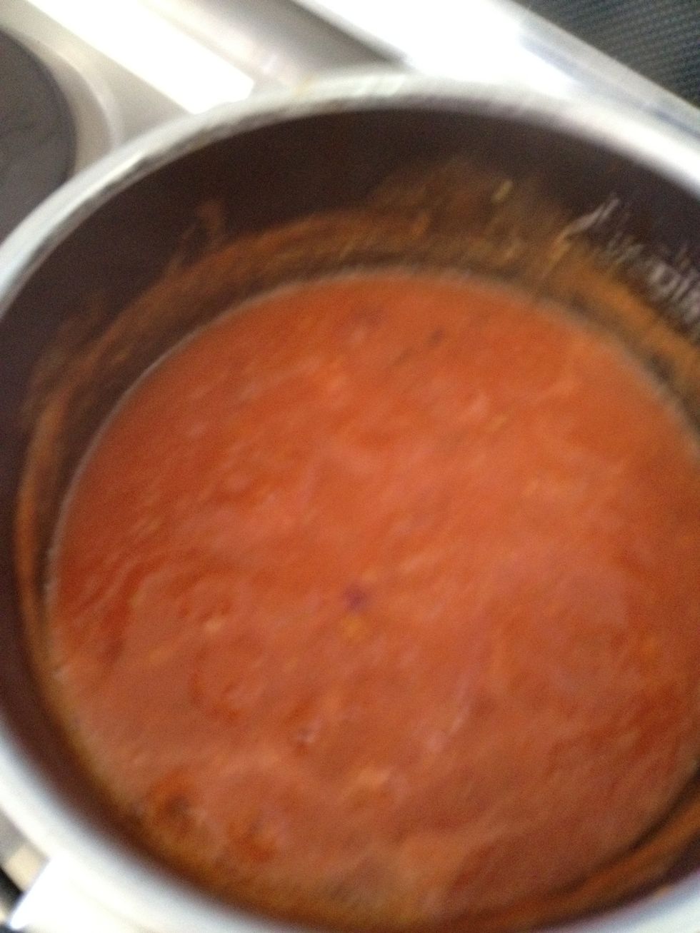 When the onions are ready put in the tomato sauce and a little black pepper mix them then put salt in and cover and put it on a small fire