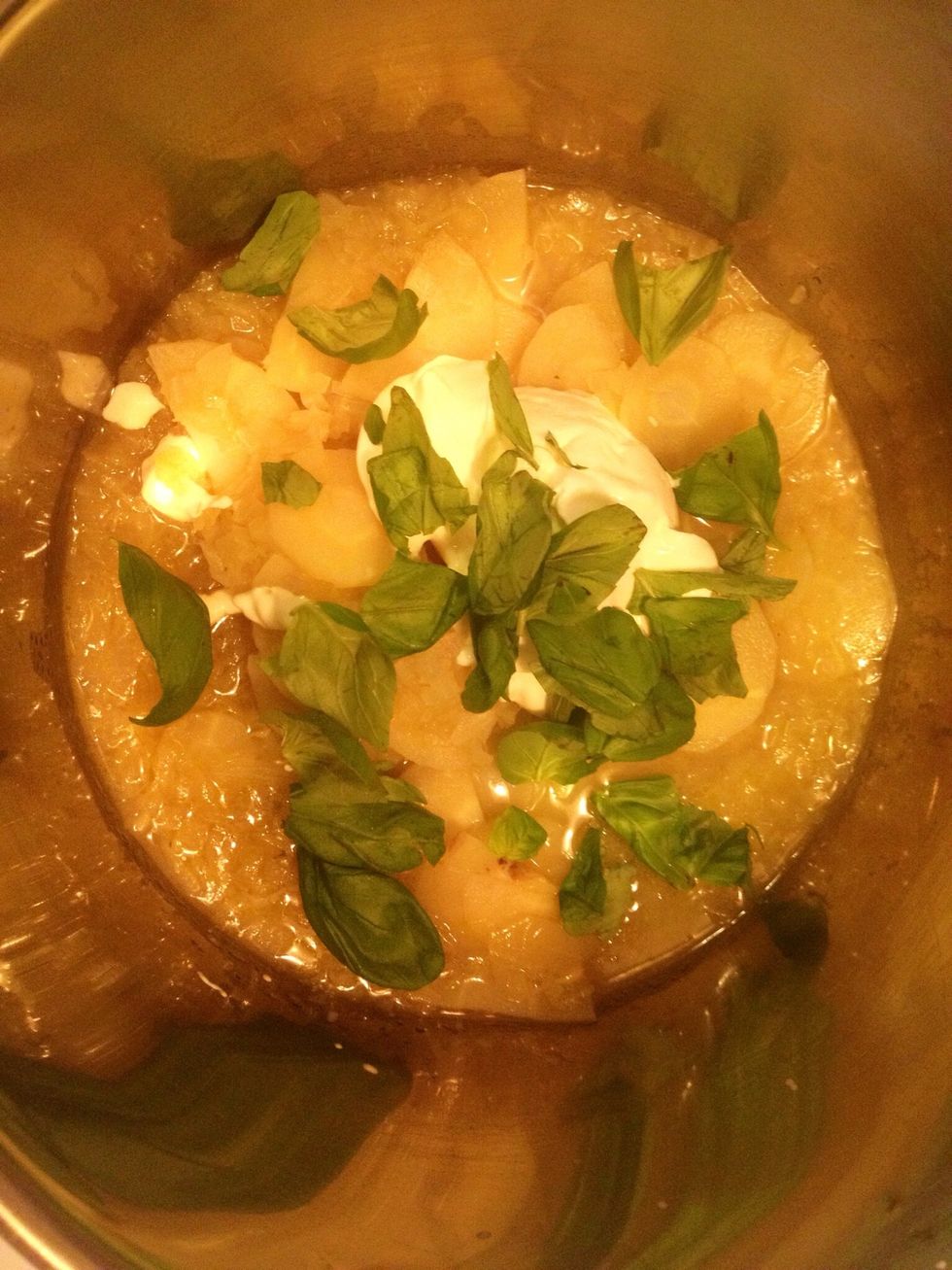 When the parsnip is soft, add creme fraiche and basil to the sauce.