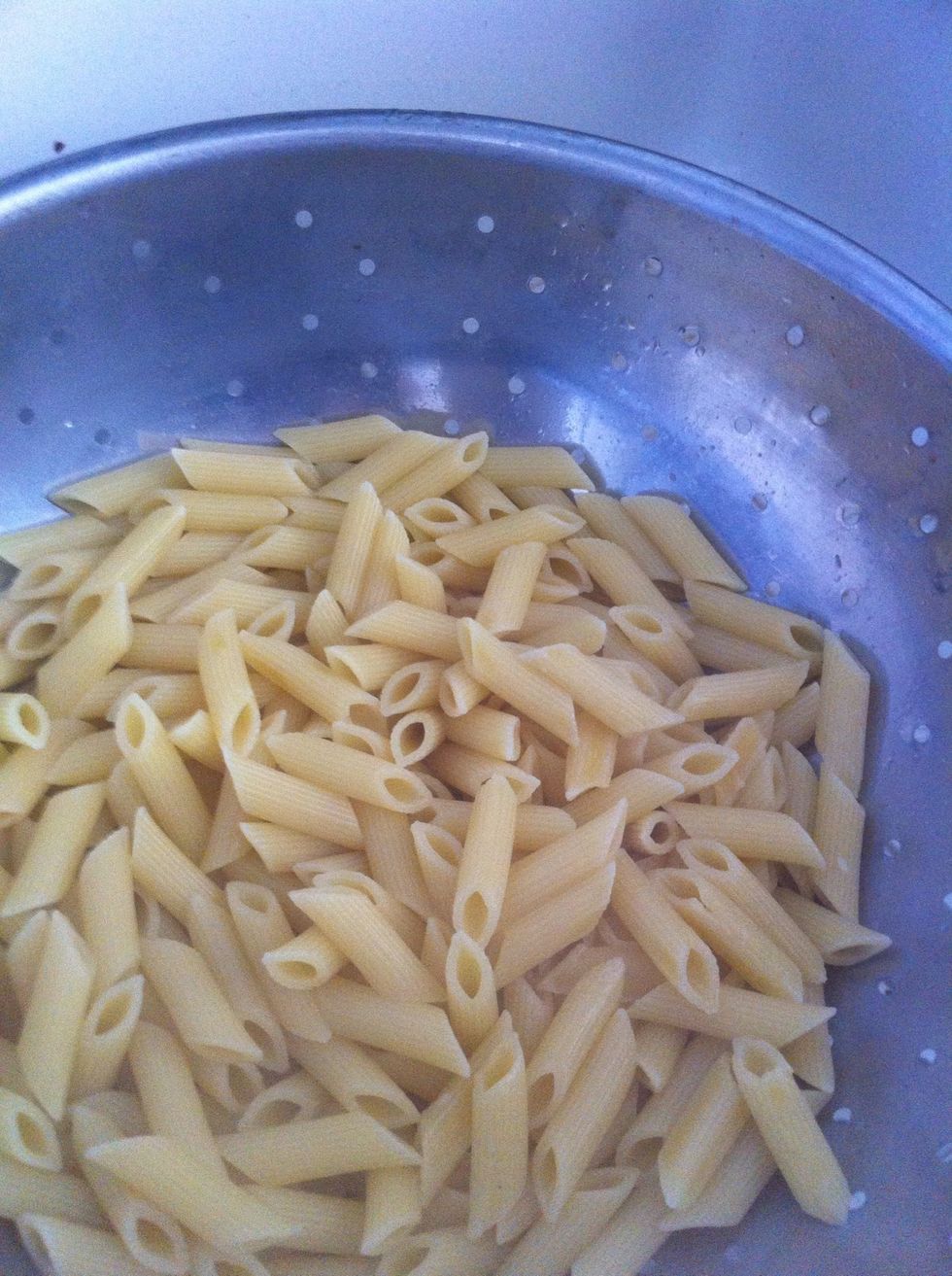 When the pasta has about 2 more minutes left, strain out the water.