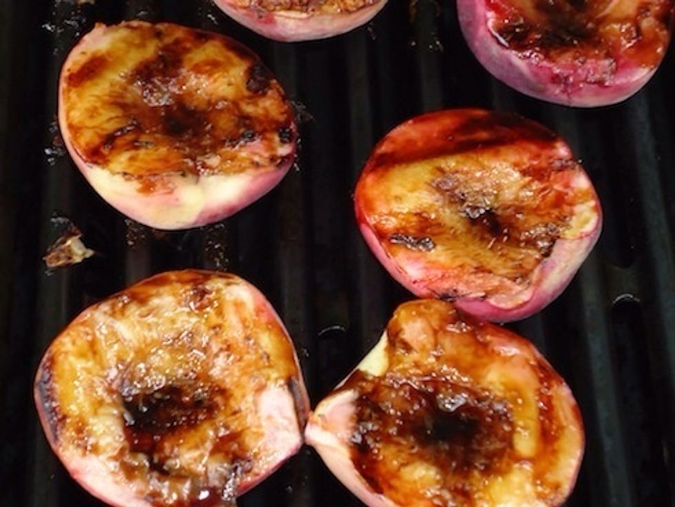 When the peaches are cooked, they will be soft and the glaze will have caramelized. Remove from the grill and serve.