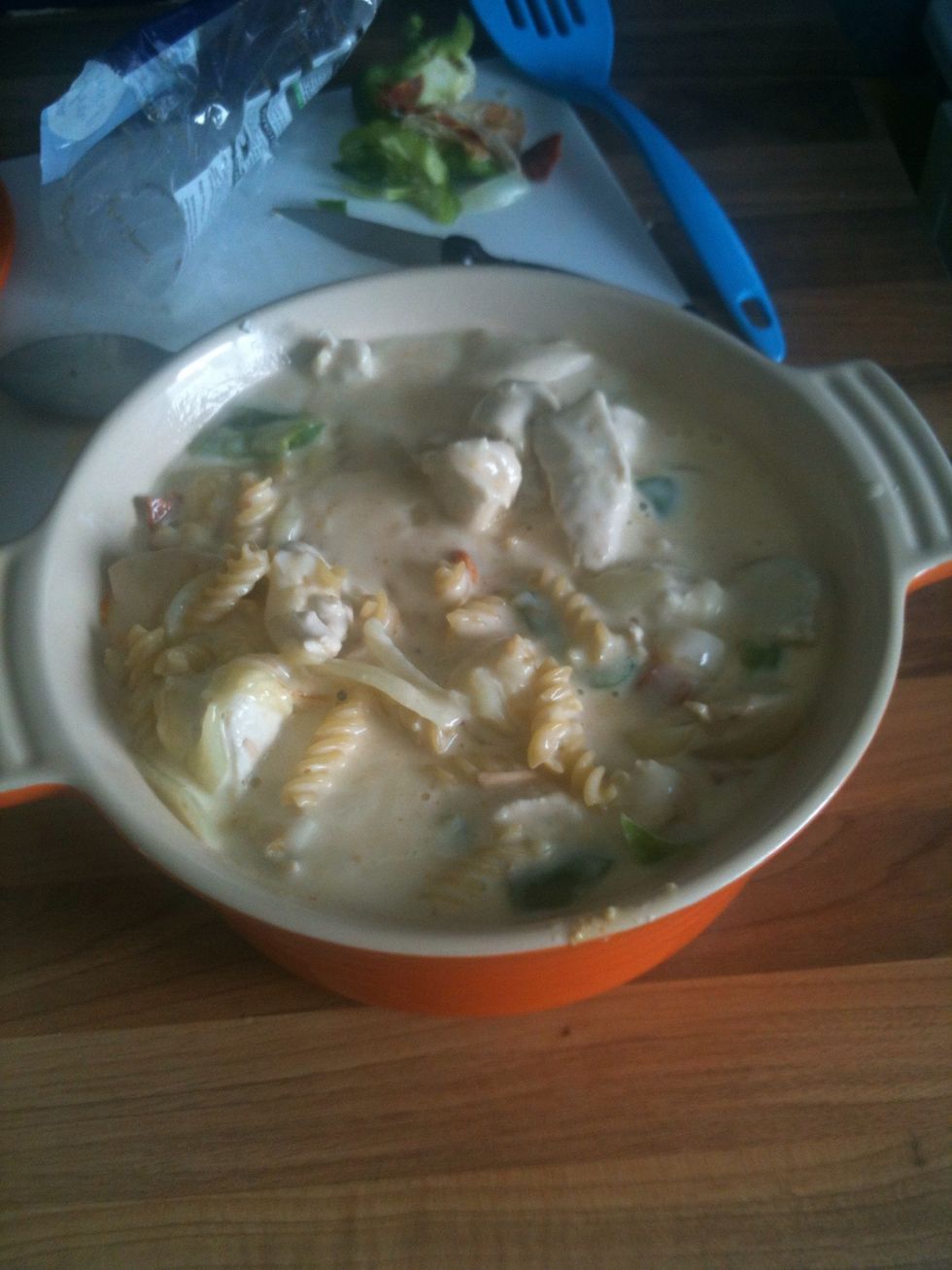 When the pepper and onion are softened add the whole panload to your casserole dish and mix. Try not to fill your dish too full, imagine the mess it would make if it overflowed in your oven!