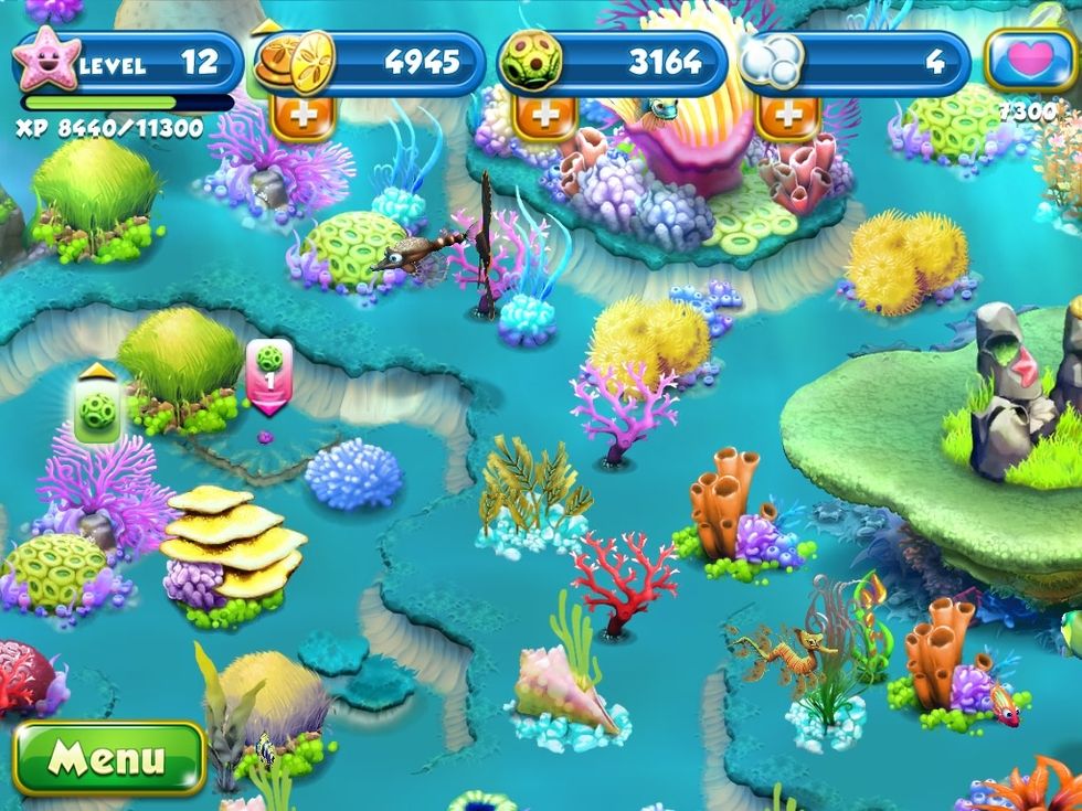 When the pink box comes up press it and it will feed your plant algae you've collected.