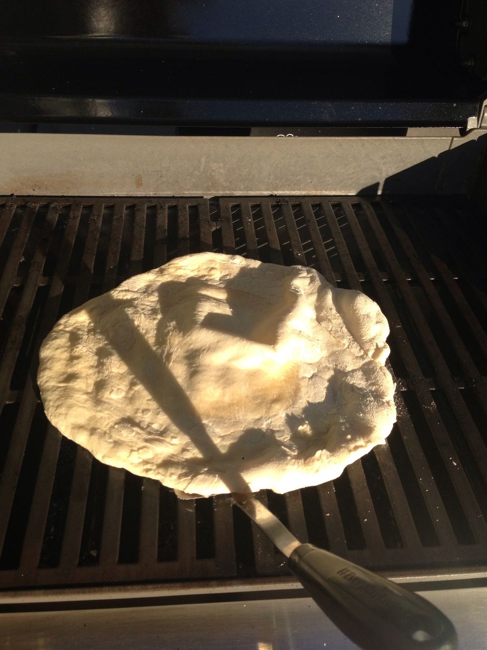 When the pizza starts bubbling, flip it over for 2 mins. I also rotated the pizza since the edges were more hot. Cover the grill again.