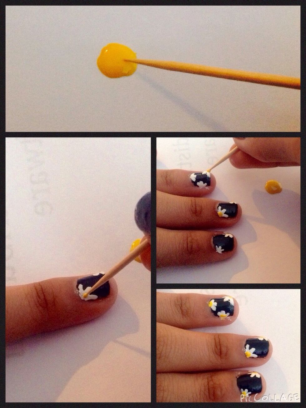 When the polish to dry, place a small yellow dots in the center of the petals.