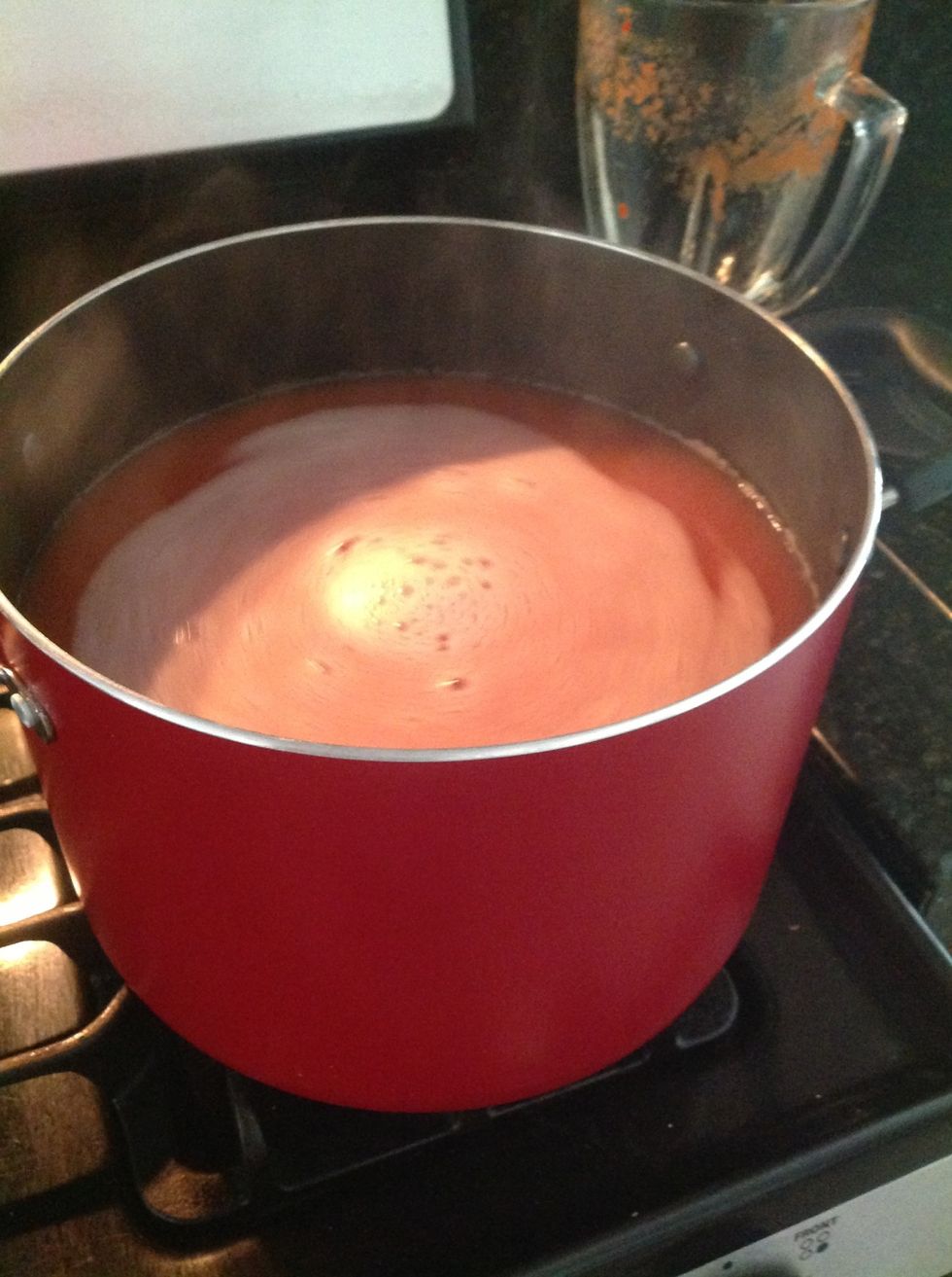When the pot is boiling again after adding the tomato paste, add the meatballs slowly