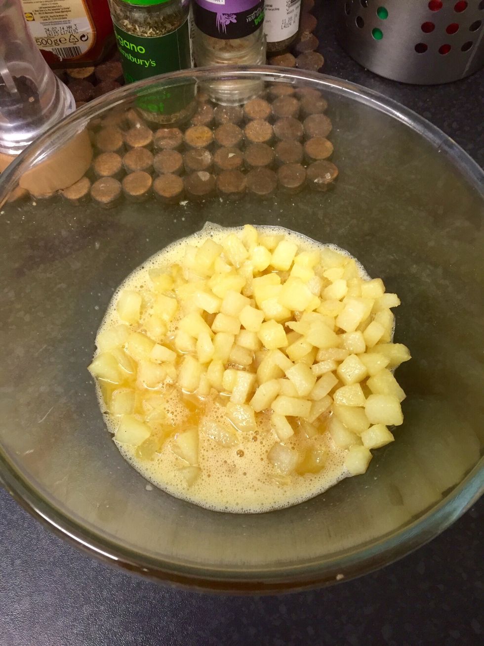 When the potatoes are cooked, add them to the eggs and mix everything well