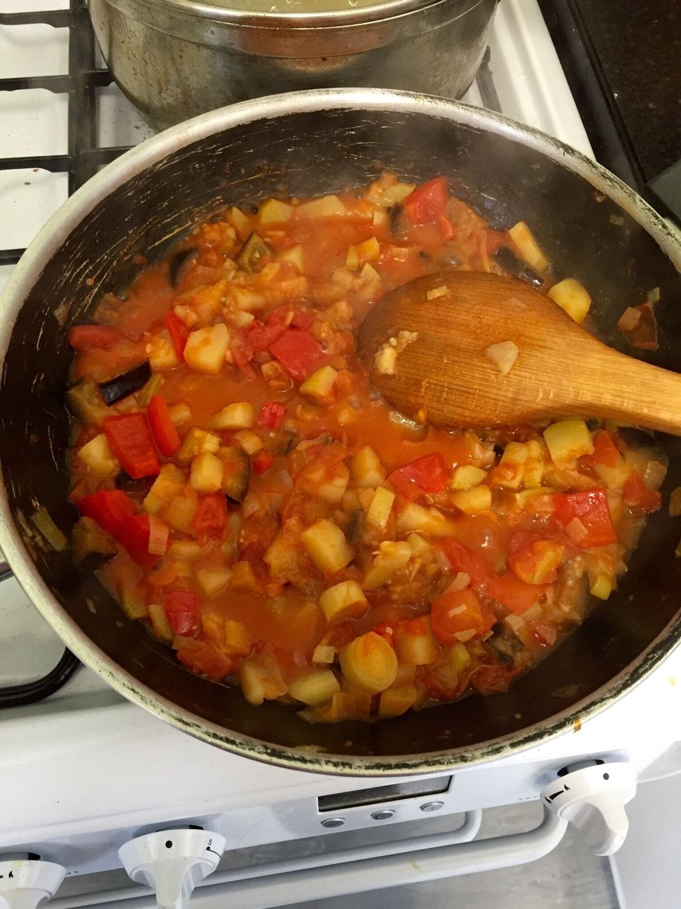 When the potatoes are halfway there, are the tin of chopped tomatoes and cover. Let it cook until the tomatoes are cooked and the potatoes soft. You can keep trying for salt and add if needed
