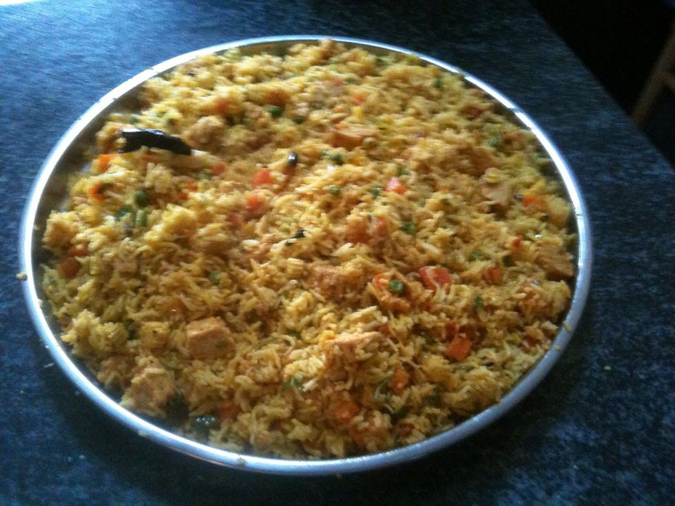 When the rice is done, add the chicken pieces mixture to it and mix well.