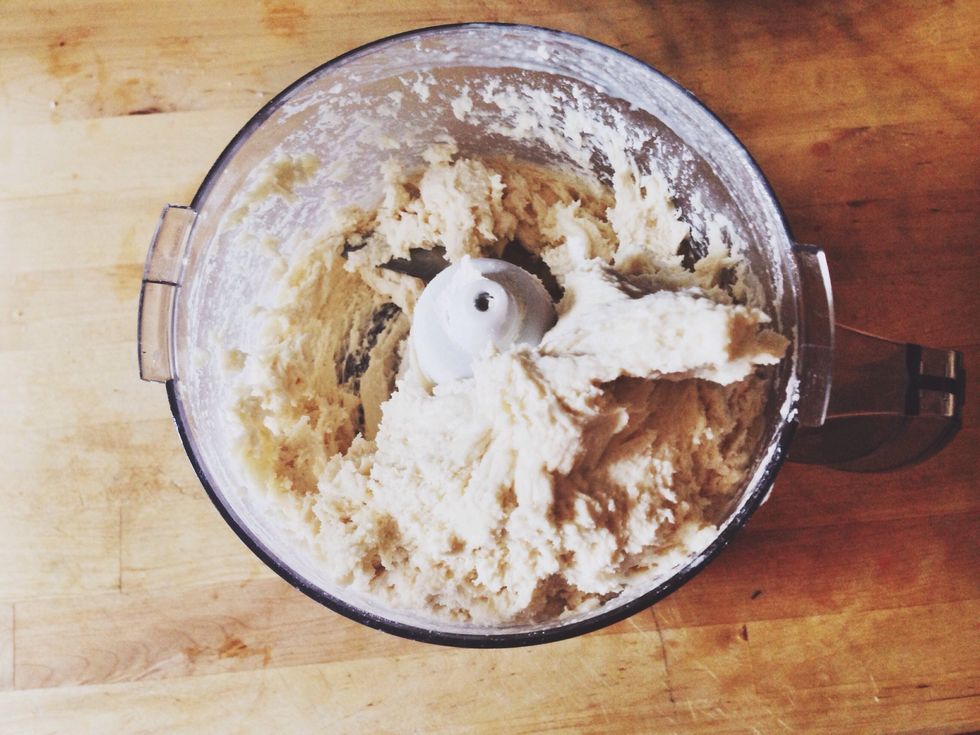 When the right amount of liquid has been used, dough will take shape, form a ball and move to one side of food processor.
