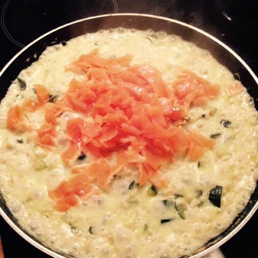 When the risotto is almost cooked and starts drying turn off the heat and add the salmon.