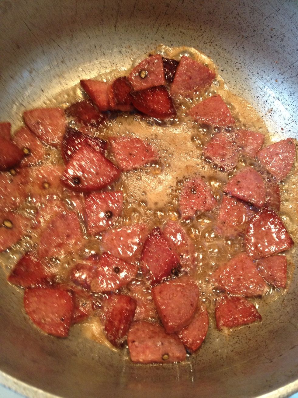 When the salami has browned. Lets lower the heat a little .