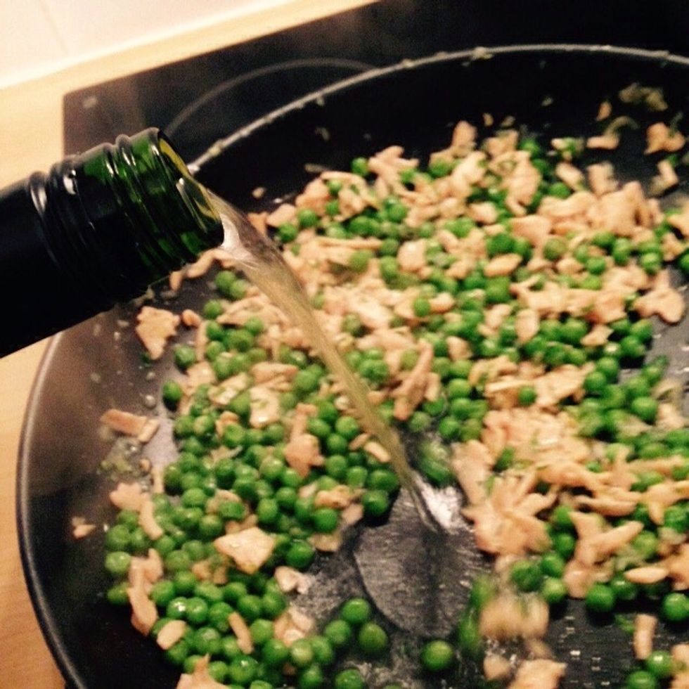 When the salmon is cooked pour in the wine