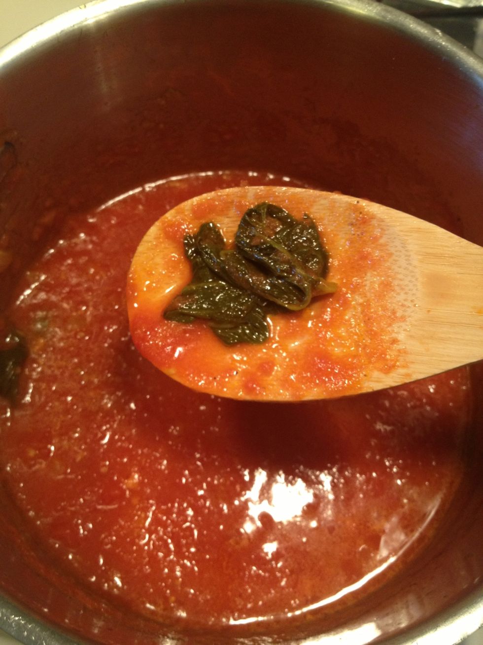 When the sauce has thickened, check for salt add it if necessary. Add sugar if it is to acidic.. Remove the large sprigs of basil and parsley. Who wants to chomp on a big piece of herb anyway
