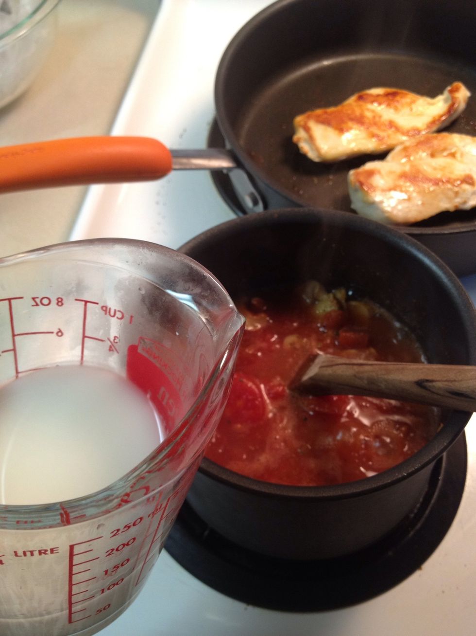 When the sauce is boiling add in the cornstarch water mixture. Better check on the chicken and flip if you haven't done so yet!!!!