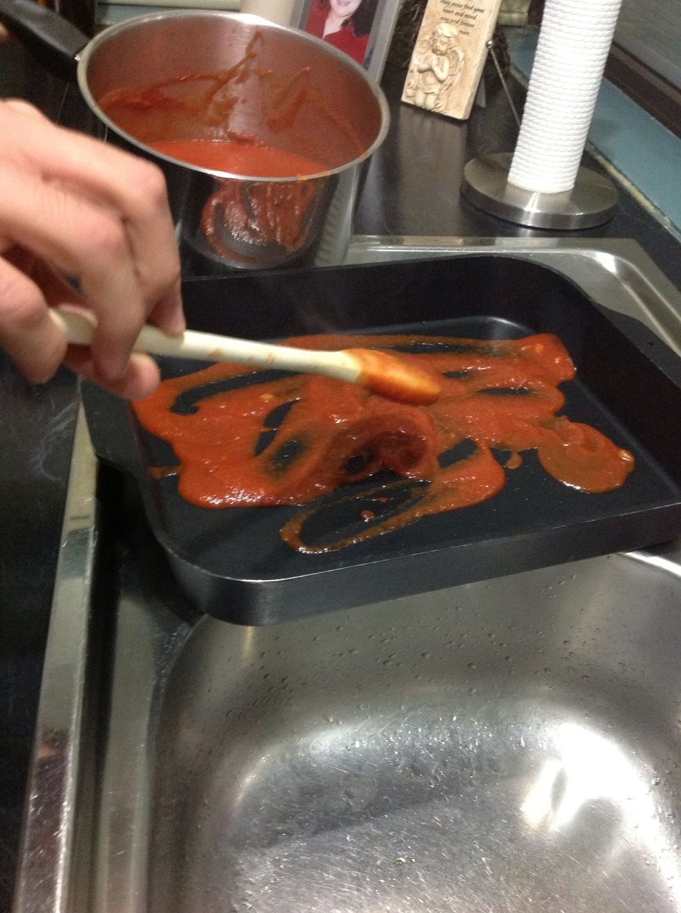 When the sauce is cooked place some on the base of the pan