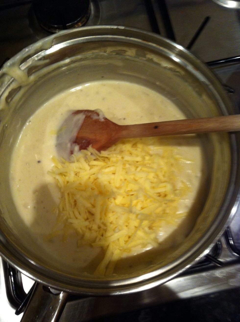 When the sauce is thick turn off the stove. Add 3/4 of the cheese and stir in really well, the cheese mixture becomes nice and gooey