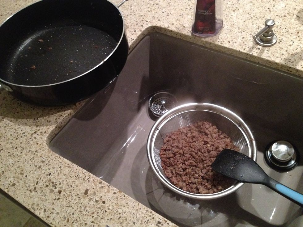 When the sausage has browned thoroughly, drain off any excess grease.