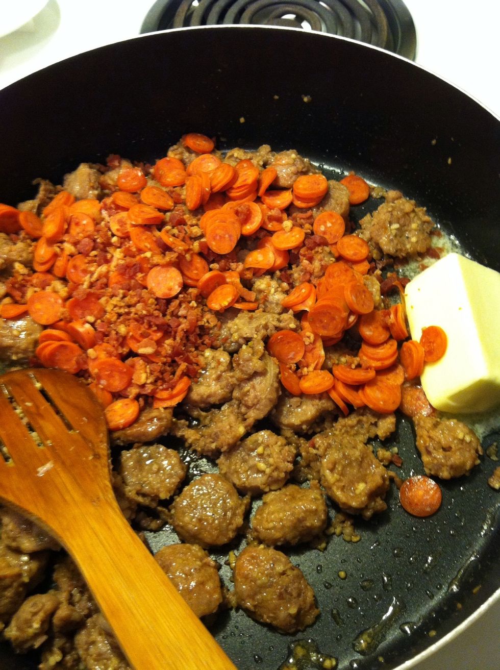 When the sausage is just about done, add the butter, the pepperoni and the bacon bits.