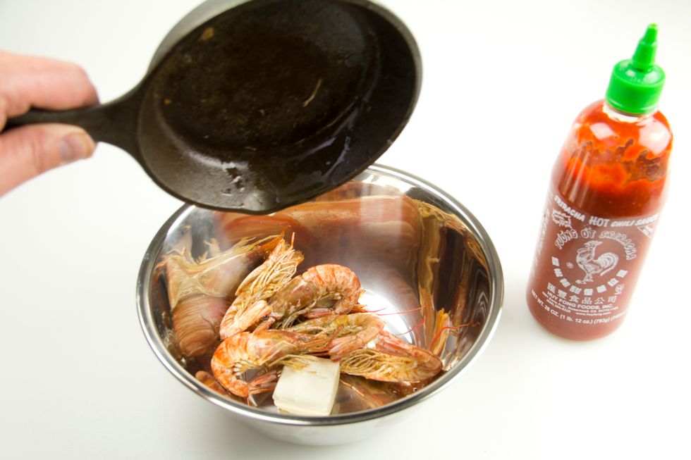When the shrimp are finished cooking, drain but do not cool. Add the hot shrimp to the pan with the sauce and butter.