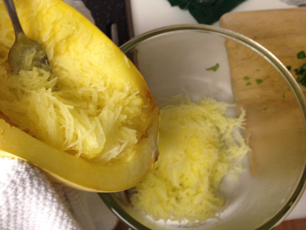 When the squash are cool enough to handle, remove the flesh from the inside using a fork. You should be able to remove them in spaghetti like strands.
