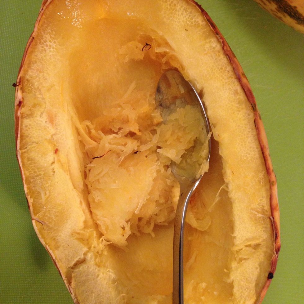 When the squash is ready use a fork or spoon and scrape out the spaghetti squash.