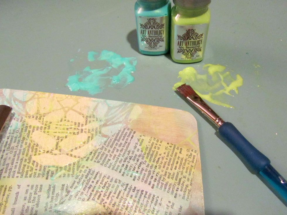 When the Stucco is completey dry add color by putting some Pixie and Tink Sobert on your craft matt. Add water and mix with a small paint brush. Paint on clipboard randomly so colors will blend.