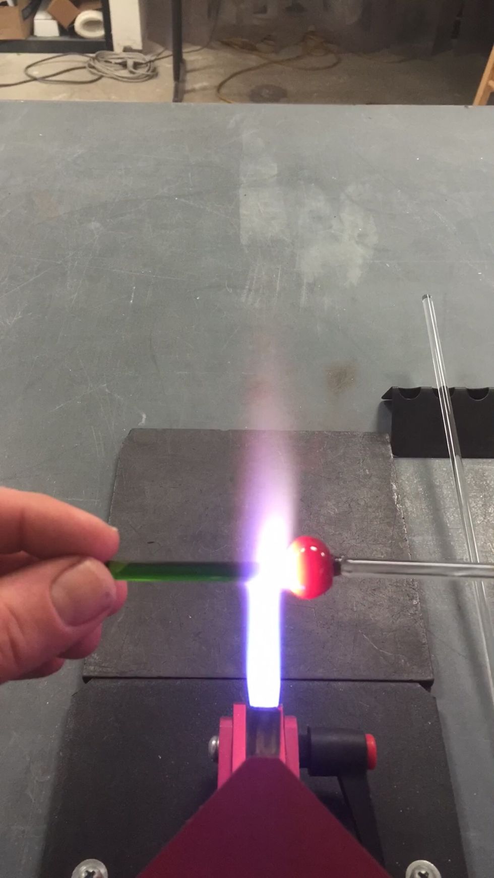 When the Thallo is too short to hold, let it go and keep rotating it in the flame. Focus the flame on the junction of the ball and the stub.