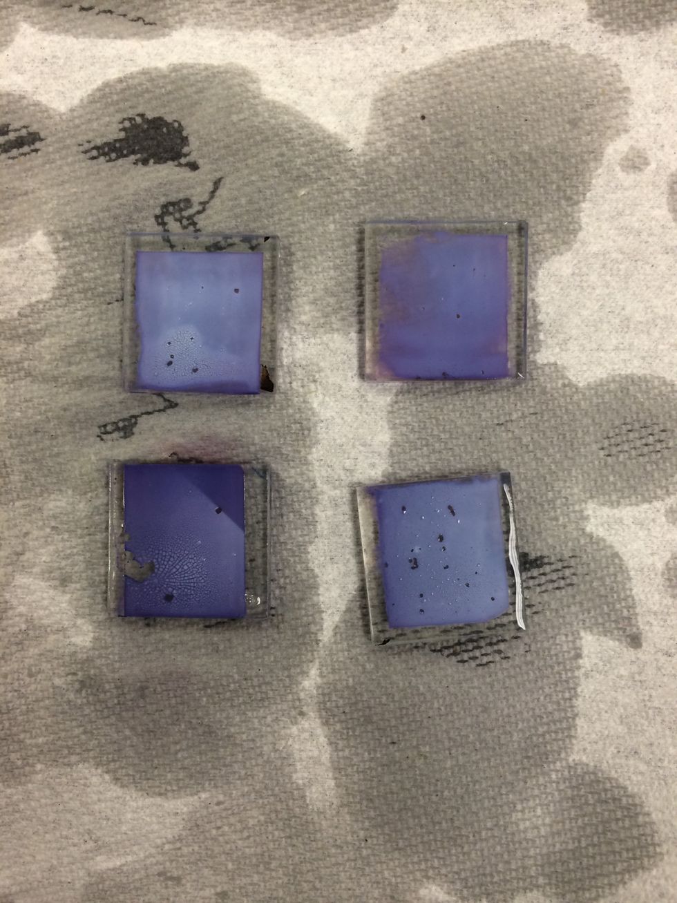 When the TiO2 coated glass has finished soaking, it should be stained dark purple.