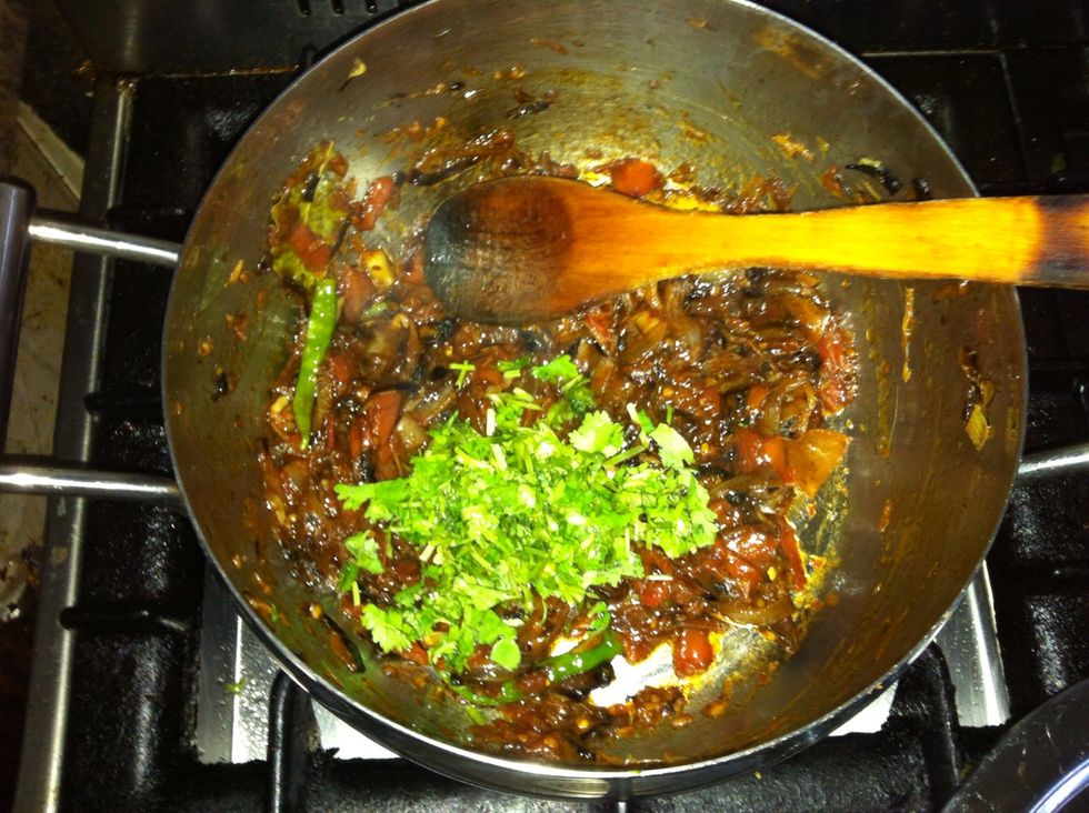 When the tomatoes "melt" into the pot, add a handful (1/4 cup) of chopped cilantro, stir it in