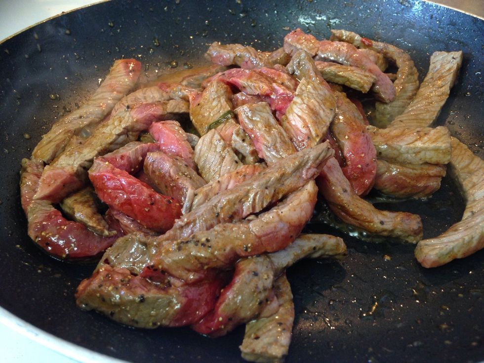 When the vegetables are caramelized, remove from the pan. Season the steak with salt, pepper, red pepper flakes, and cayenne pepper. Place steak into the large saut\u00e9 pan, and cook for about 5 minutes