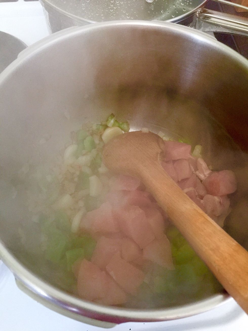 When the vegs are cooked, add the chicken and cook until sealed