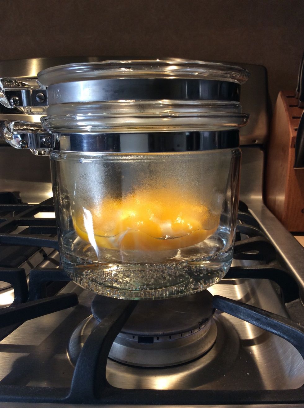 When the water comes to a simmer, add the cooking pot to the double boiler.