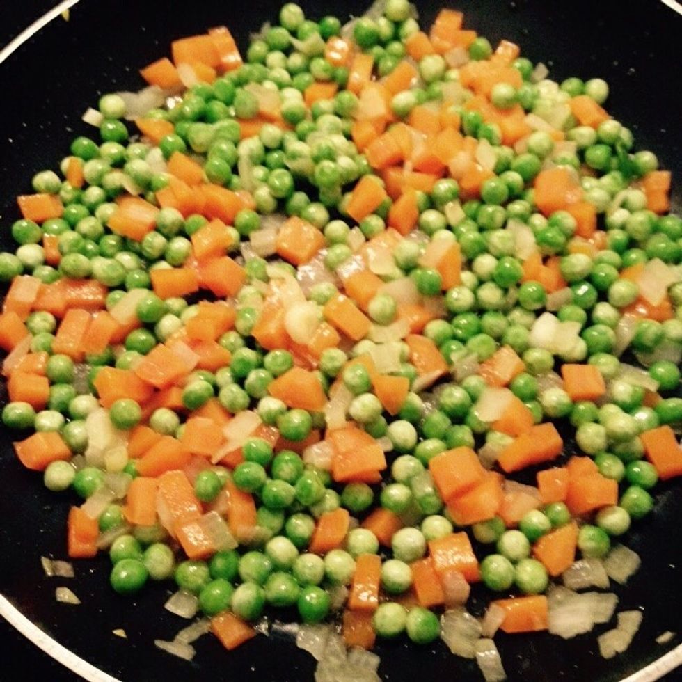When the water dries off add the peas in and saut\u00e9 for few minutes